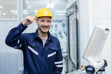 Portrait of happy smiling male engineer workers standing in manufacturing factory workplace. professional technician production operator CNC machine at factory.