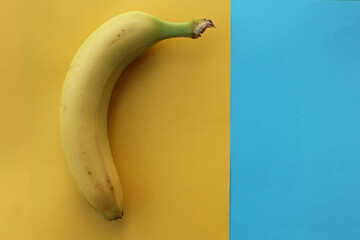 Banana on a yellow and blue background