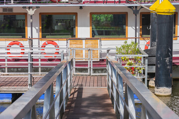 Fototapeta na wymiar wooden gangway for the boat in river port