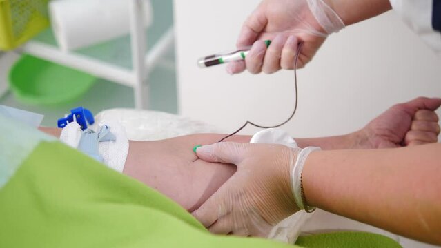 Healthcare concept. Laboratory in clinic. Female lab assistant taking venous blood for test. HIV Hepatitis Test. 4 k video