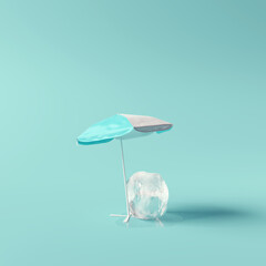 Beach umbrella with ice cube on blue background. Creative summer minimal idea. Sun protection concept. 3d rendering