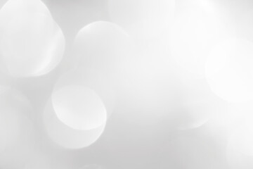 A brilliant white background with circles and ovals. Template for a holiday card with bright and sparkling lights.