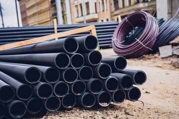 Big construction site with pipes and wires in the construction area.
