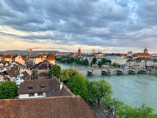 Fototapeta na wymiar View of Basel and its Cathedral and the river Rhine at sunset 