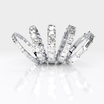 Multiple diamond eternity rings on white background. 3d rendering