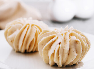closeup vanilla cream on white plate