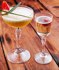 sweet alcoholic orange cocktail with foam and champagne