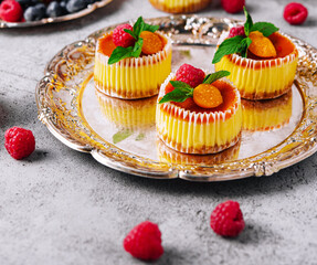 Mini cheesecake with apricot in muffin forms