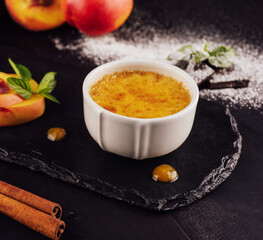 cup of creme brulee with apricot pieces