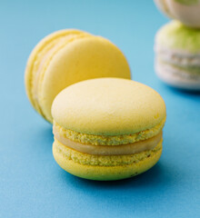 Sweet and colorful macaroons on blue background