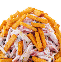 Salad with croutons and mayonnaise on plate on white background