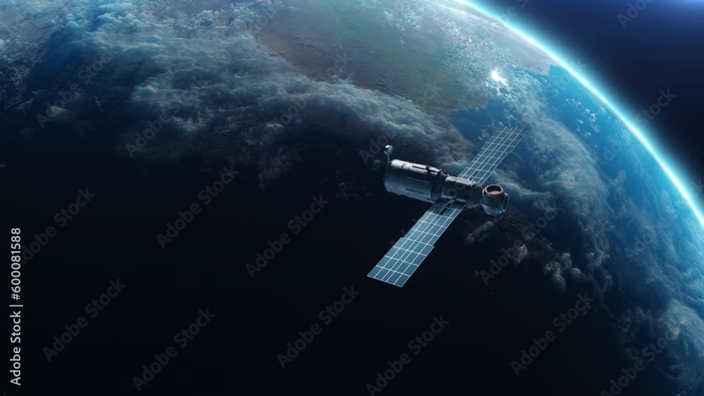 Wall mural sputnik or space module orbiting planet earth. the concept of technology and space