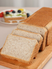 Scene with toast bread with fruit and milk, healthy breakfast, indoor kitchen photography