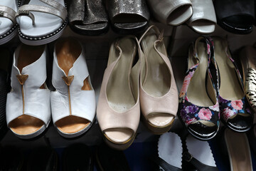Women's sandals on shelf in store