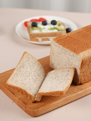 Scene with toast bread with fruit and milk, healthy breakfast, indoor kitchen photography