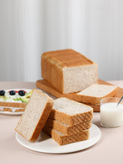 Scene with toast bread with fruit and milk, healthy breakfast, indoor kitchen photography