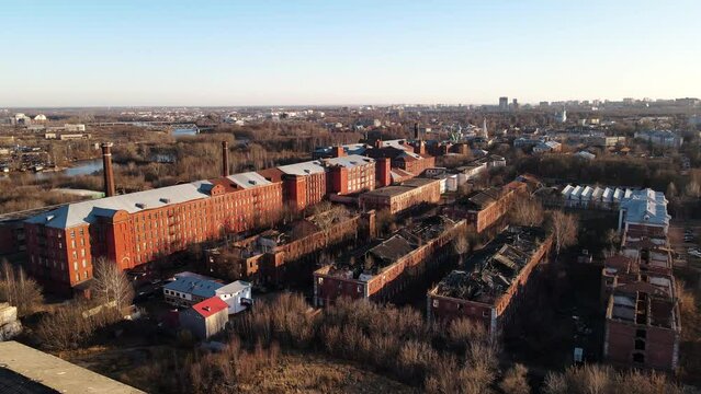 Aerial straight down view of an informal settlement squatter camp right next to middle class suburban housing,Aerial footage of bombing, House explosions, Real War, damaged city and destroyed roofs of