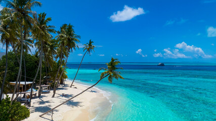 Naklejka na ściany i meble The summer tropical on the sandy beach and turquoise Tropical beach with blue sky background
