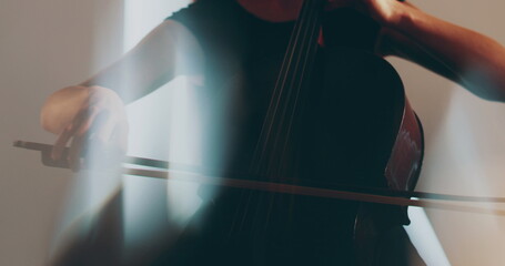 Single woman playing the cello, close-up and medium close-up, cello bow and strings, smooth...