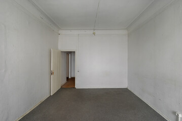 Empty room without furniture in an old apartment building. Unrenovated empty room