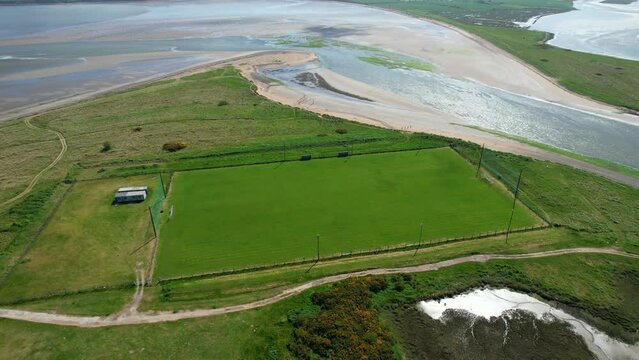 Aerial view of Pilmore Strand and the St Itas GAA pitch near Youghal in county Cork Ireland