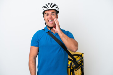 Young caucasian man with thermal backpack isolated on white background with surprise and shocked facial expression