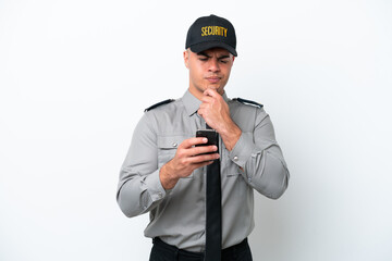 Young caucasian security man isolated on white background thinking and sending a message