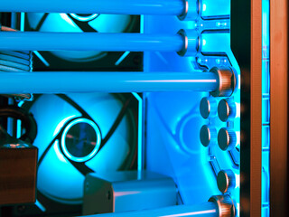 View from inside a fragment of a water cooling system in a high-performance modern computer with a beautiful blue LED backlight. Soft focus. - 600099164