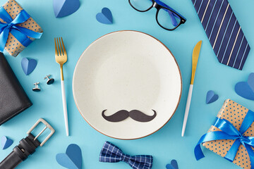 Festive table setting for Father's Day. Top view flat lay of empty plate, cutlery black mustache,...