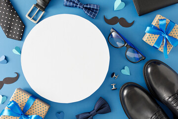 Father's Day celebration concept. Top view flat lay photo of gift boxes trendy shoes mustache men's accessories and paper hearts on blue background with circle blank for text or advert