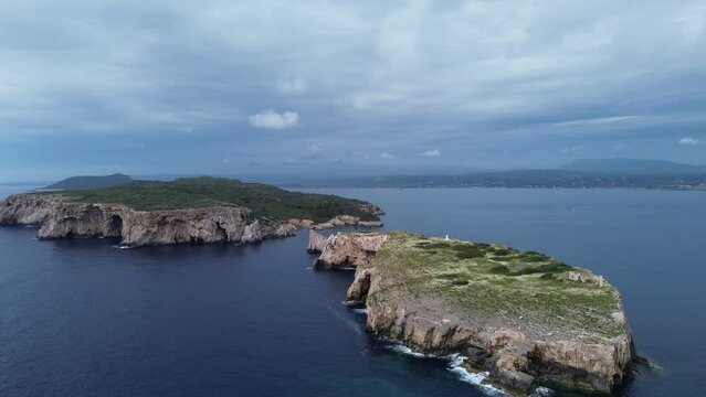 Breathtaking aerial sunset view of the Historical rocky limestone Tsichli-Baba island south of Sphacteria where is the erected monument to the French fallen sailors in the Battle of Navarino