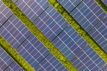 Rows of polycrystalline solar panels. Former farmland or agricultural areas in the countryside used...
