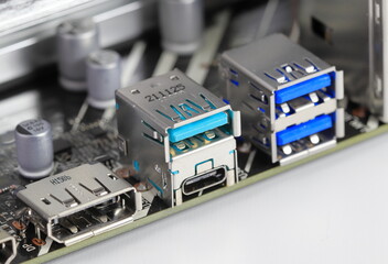 Multiple ports on modern computer mainboard show with Display port, USB 3.2 type A and type C, usb 3.1.