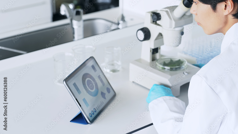 Poster a man observing with a microscope. scientific experiment.
