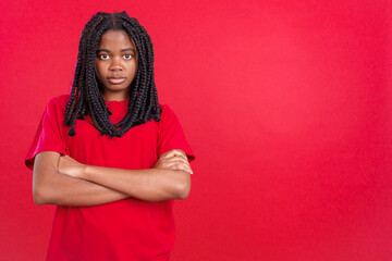 African woman crossing the arms with an angry expression