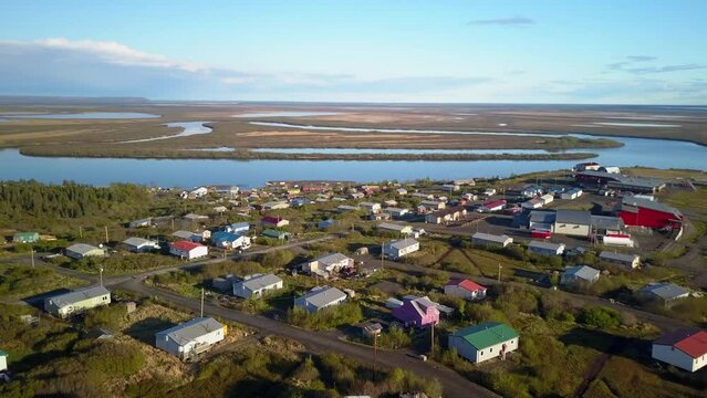 Aerial Panning Shot Of Human Settlement Near Sea Against Sky, Drone Flying Over Coastal Houses - Bering Sea, Alaska