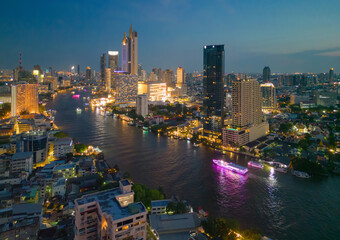 Aerial view of Bangkok Downtown Skyline, Thailand. Financial district and business centers in smart urban city in Asia. Skyscraper and high-rise buildings with Chao Phraya River.