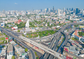 Fototapeta premium Aerial view of Bangkok Downtown Skyline, Thailand. Financial district and business centers in smart urban city in Asia. Skyscraper and high-rise buildings at sunset.