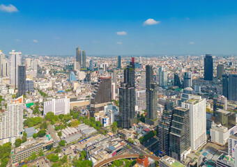Naklejka premium Aerial view of Bangkok Downtown Skyline, Thailand. Financial district and business centers in smart urban city in Asia. Skyscraper and high-rise buildings at sunset.