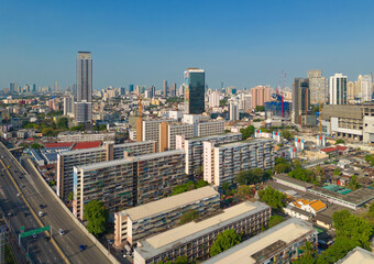 Naklejka premium Aerial view of Bangkok Downtown Skyline, Thailand. Financial district and business centers in smart urban city in Asia. Skyscraper and high-rise buildings at sunset.