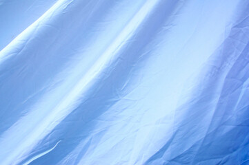Obraz premium White fabric with wrinkles and one background
