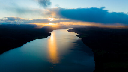 sunset over the lake. The setting sun over the lake as the evening sun sets. wonderful sky