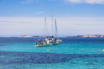 Fototapeta premium Ibiza beaches with beautiful turquoise waters. Beach at Sant Antoni de Portmany - Ibiza