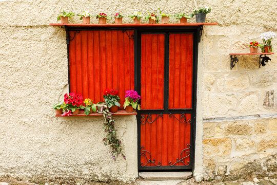 red door in a village stone house
