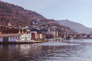 Sea side harbor and a tower on the fjord above the city during a sunny day