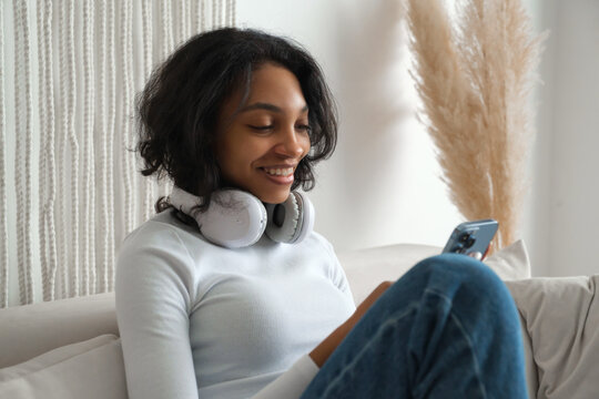 Freelancer gitl works at home using smarphone. Modern technologies