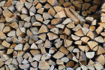 Firewood is stacked. Firewood for heating the house.