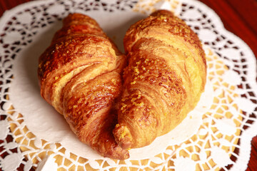 Handmade French croissant on the kitchen table, with natural light