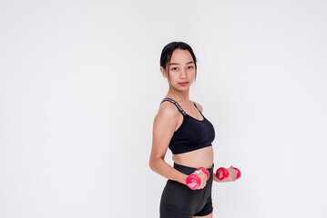 A sporty and young woman weightlifting and working out using a dumbbell, side view. Isolated on a white background.