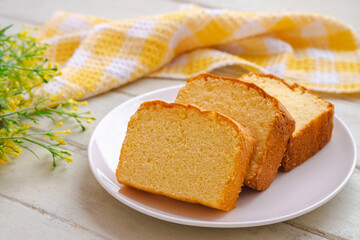 Butter cake sliced on white plate